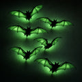 Six black bat silhouettes with wings glowing acid green against a dark wall